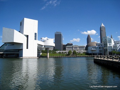 Rock and Roll Hall of Fame (left) with the Cleveland Skyline, on Lake Erie.