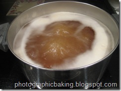 Boiling bagels in water and malt syrup