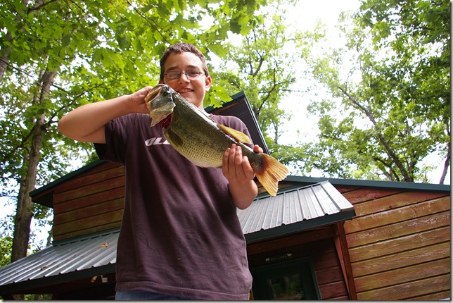 Travis holding a 21 inch Bass