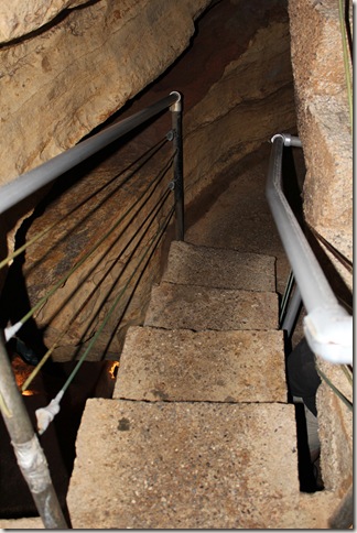 concrete steps down into the cave