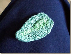bi-coloured knitted leaf