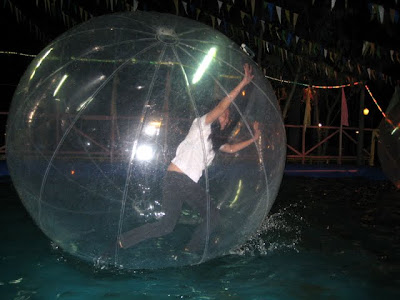 Eboi attempting to stand and walk on water inside the Zorb Ball