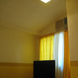 A perfect vision of our LCD TV inside our yellow-toned bedroom