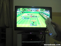 Playing Wii Sports tennis on our Toshiba Regza 32" LCD TV