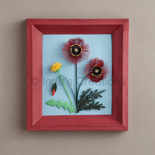 Quilled poppies and dandelion, framed