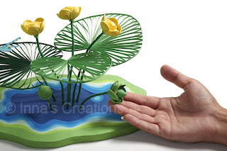 Quilled yellow water lily (with hand)