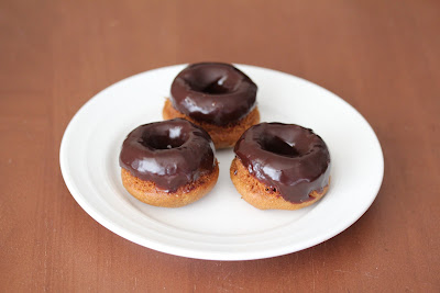 photo of three donuts on a plate