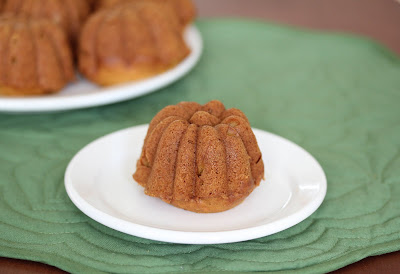 photo of a pumpkin spice cake on a white plate