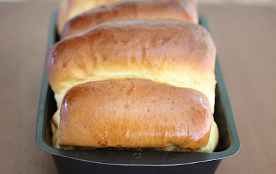 close-up photo of a loaf of milk bread in a pan