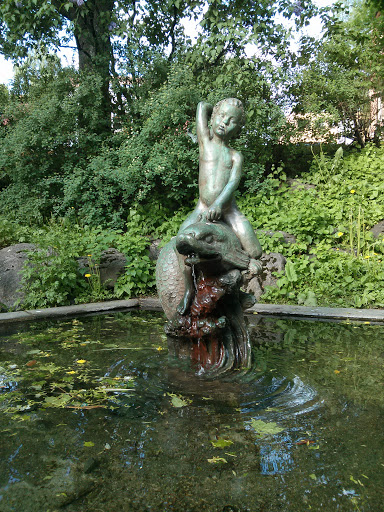 Boy on Fish Fountain