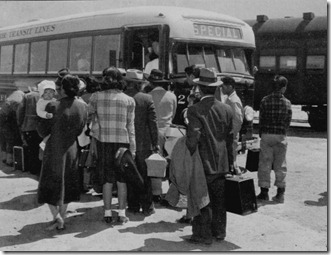 Buses taking Japanese-Americans to the War Relocation Centger at Manzanar