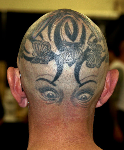 Weird tattoo design on back of head