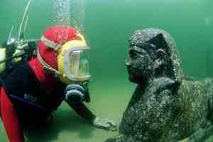 A diver stares down a black granite sphinx believed to represent Ptolemy XII, Cleopatra's father. Archaeologists found the sphinx during excavations in the ancient harbor of Alexandria