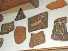 Copies of petroglyphs found throughout the Mojave Desert are shown at the Mojave River Valley Museum Wednesday. Petroglyphs at Inscription Canyon bear fresh signs of vandalism and theft.