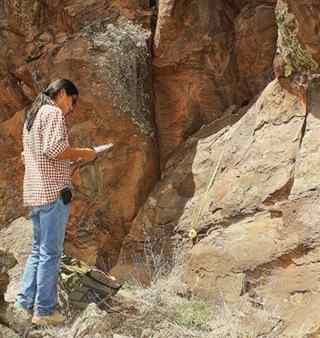A member of the Navajo Nation Archaeology Department (NNAD) documents a panel of petroglyphs. On April 28, Kaibab Heritage Program employees conducted a petroglyph documentation class for members of the NNAD. Near a significant Cohonina village site on the Williams Ranger District, the Kaibab and NNAD archaeologists were able to record about 75 percent of the petroglyphs. They recorded 20 panels with more than 100 motifs.