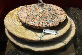 Recently excavated stone plates lie in a bath of fresh water to desalinate them, onboard the Princess Duda research boat, anchored in the harbor of Alexandria