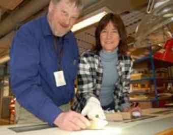 Tomb raiders: Archeologists Olle Hemdorff og Eva Thäte investigate finds of older artifacts in younger graves. The axe from the Stone Age and the pearl from the Iron Age have been found in the same grave at Avaldsnes.