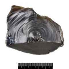 A stone worked by early human settlers in Britain to become a cutting tool.