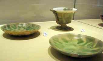 These white-and-green ceramic wares originating from the 9th century, were recovered from the Belitung shipwreck in 1998