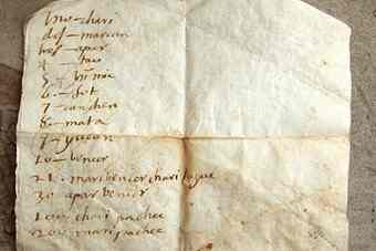 The back side of an early 17th-century letter shows translations for numbers from Spanish to a lost language. Photo by Jeffrey Quilter. 