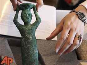 A Babylonian clay foundation cone, ca. 2100 BC, is displayed at the Iraqi Ministry of foreign Affairs in Baghdad, Iraq, Tuesday, Sept. 7, 2010. Hundreds of Iraqi artifacts looted from museums and archaeological sites across the country have been returned to Iraq. The display is part of Iraqi efforts to repatriate its looted cultural heritage