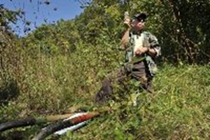 Instructor Martin McAllister shows a 1,200-year-old ax head from a mock crime scene. If the artifact had been stolen, it could mean prison time and a fine of up to $250,000.