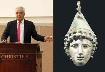 An auctioneer sells the Crosby Garrett Helmet, which was expected to fetch only £300,000 