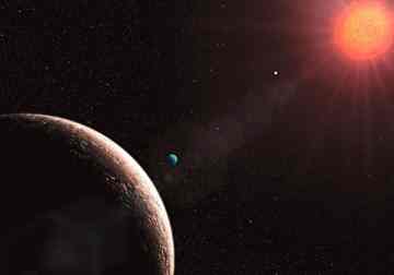 An artist's impression of the planetary system around Gliese 581, including one of the lightest exoplanets yet discovered, Gliese 581e. The Gliese 581 planetary system now has four known planets, with masses of about 1.9 (planet e, left in the foreground), 16 (planet b, nearest to the star), 5 (planet c, center), and 7 Earth-masses (planet d, with the bluish colour). Credit: ESO/L. Calcada