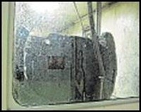 The logboat in its chamber at Hull and East Riding Museum