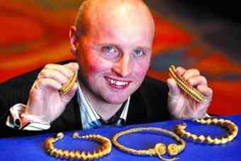 Safari park worker David Booth with the 2000-year-old haul he unearthed.