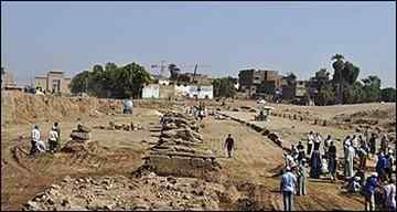 Egyptian workers at the site of the newly excavated Avenue of the Sphinxes on a sandstone section of a road that dates back from 380-362 B.C., at the city of Luxor, southern Egypt. Egypt's antiquities department says archaeologists have unearthed 12 more sphinx statues along the ancient avenue connecting Luxor and Karnak temples. (AP Photo/Supreme Council of Antiquities) (Ho - AP) 