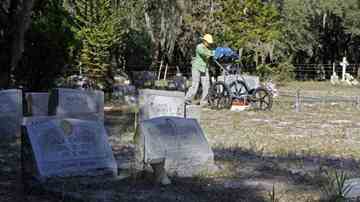 Aliceia Alfardo, an USF student and member of the Florida Public Archaeology Network, uses ground penetrating radar to search for graves of war veterans at Samford Cemetery in Riverview. 