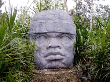 The Olmecs were the first to leave signs of their culture for succeeding civilizations to contemplate, but the colossal stone heads, each carved from basalt rock weighing as much as 30 tons procured from hundreds of miles away, raise more questions than they answer. [Photo: Naaman Abreu / Shutterstock]