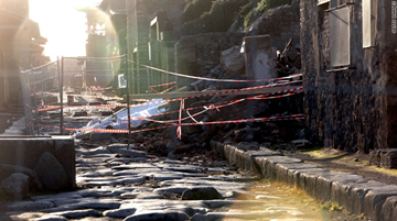 View of the cordoned-off House of the Gladiators after heavy rainfall led to the building's collapse.