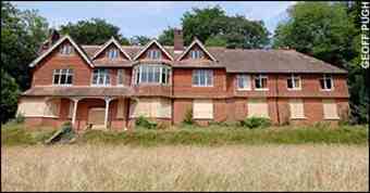 Undershaw in Hindhead, Surrey, is now boarded up after attacks by vandals.