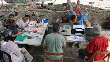Part of the Tel Aviv University team work on some of their discoveries at the archaeological dig which is located in the Jezreel Valley in northern Israel.