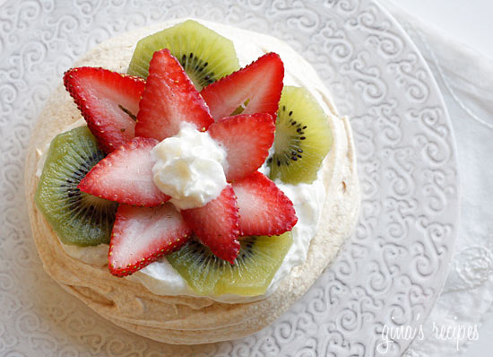 This Pavlova recipe is elegant yet light, made with whipped egg whites and sugar, then topped with cream and fresh fruit. The perfect light dessert!