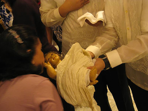 venerating the infant Jesus after the Christmas Eve Mass