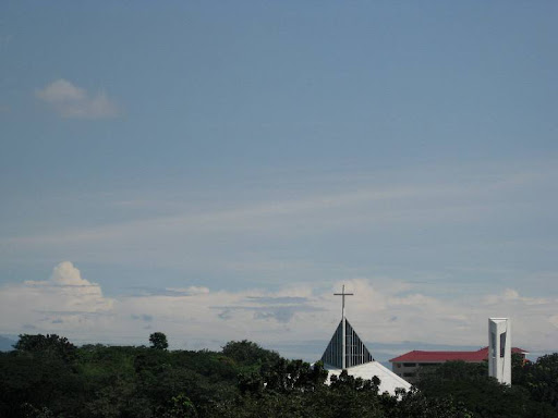 Ateneo Church of the Gesù, its bell tower, and the dormitory of the Ateneo de Manila university