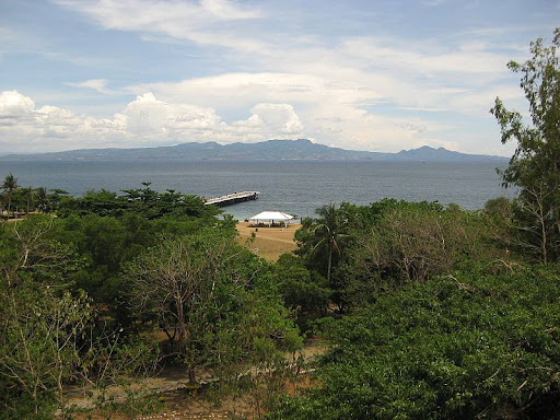 view of the South Dock, South Channel and the hills of Cavite from the dining room of Corregidor Inn