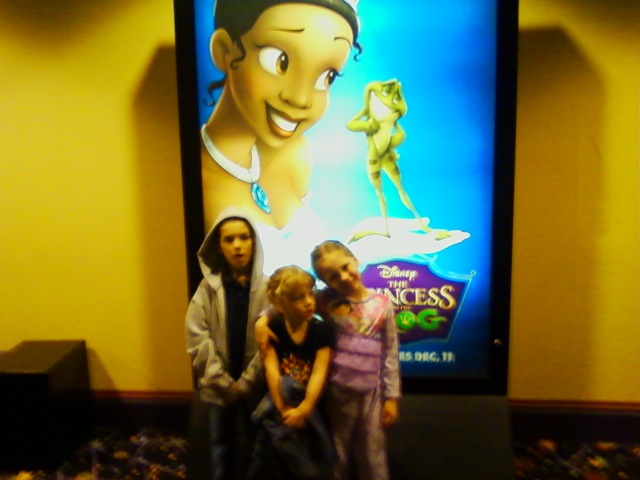 [The kids in front of the movie poster[2].jpg]