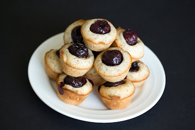 photo of Mini cherry almond cakes piled on a plate