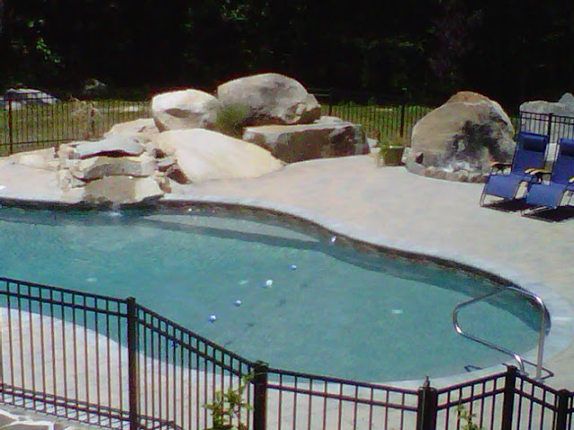 Waterfall feature on an in-ground pool in MA