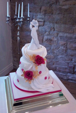 [2-tier-drape-rose-and-figure-cake[2].jpg]