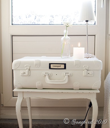 White suitcase nightstand