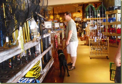 Tony and Sheba shopping at the Bass Pro Shop in the fishing department.