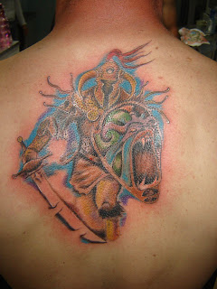 Warrior tribal back tattoo