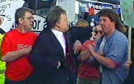 JOHN PRESCOTT reacting to an egg-throwing protestor