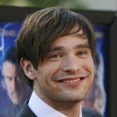 Cool side swept bangs hairstyle from Charlie Cox