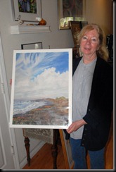 Susan Goodmundson with one of her paintings.